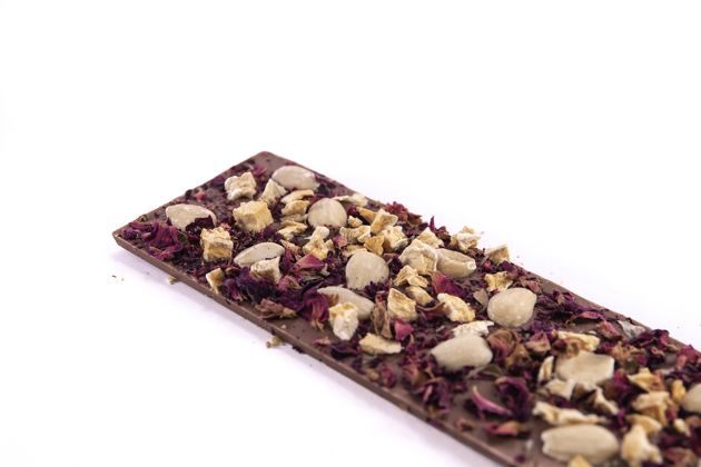 Milk chocolate with almonds, peach and rose flowers