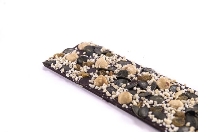 Dark chocolate with pumpkin seeds, hazelnuts, almonds and raisins