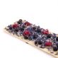 White chocolate with blue flowers, raspberries and black currants